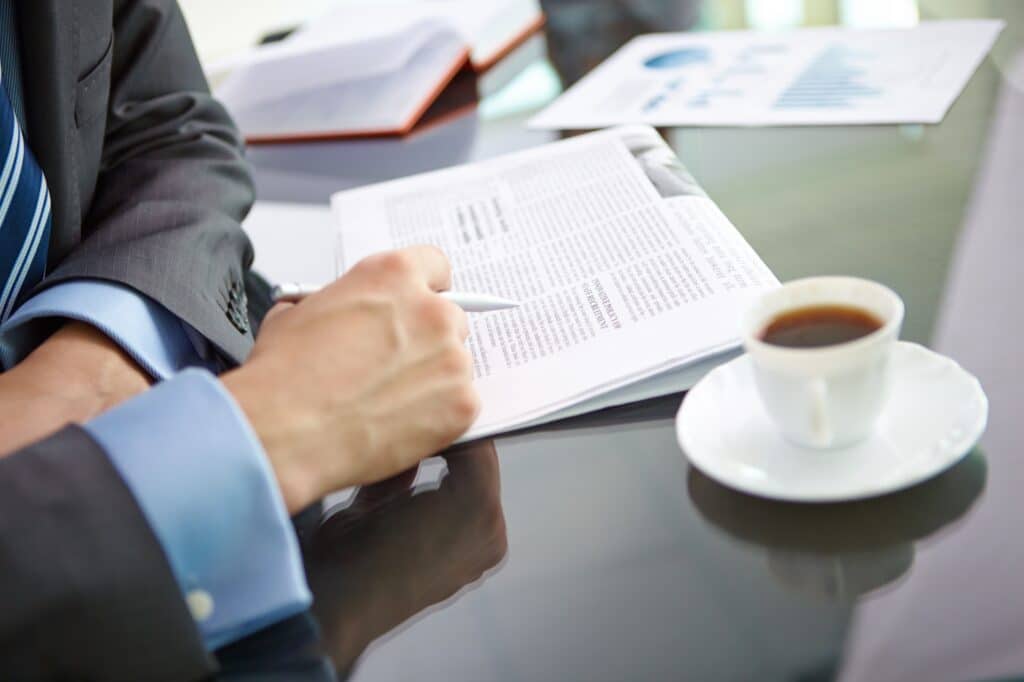 Legal professional reviewing detailed documents as part of a careful immigration strategy