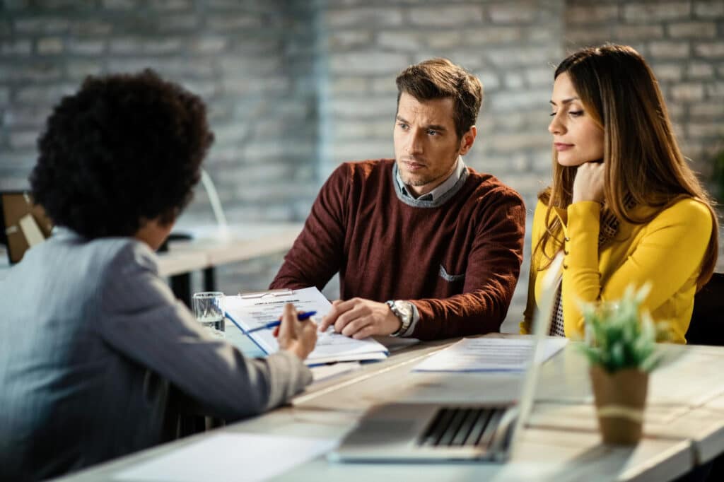 Couple attending a spousal sponsorship legal consultation