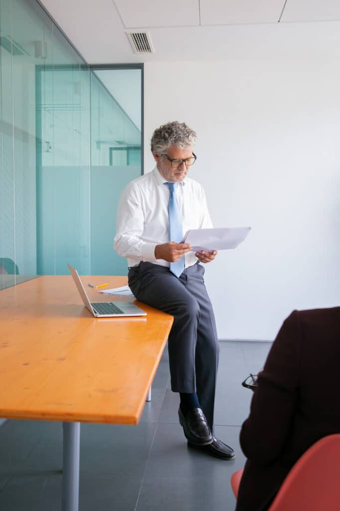 Lawyer reading legal documents in a modern office
