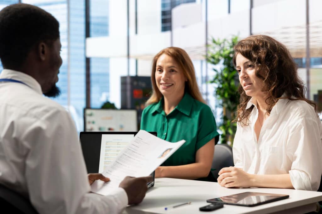 Legal team interviewing a client for a detention review